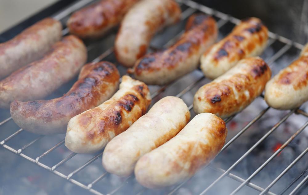 Bratwurst is commonly prepared on a barbecue grill, like hot dogs or sausage.