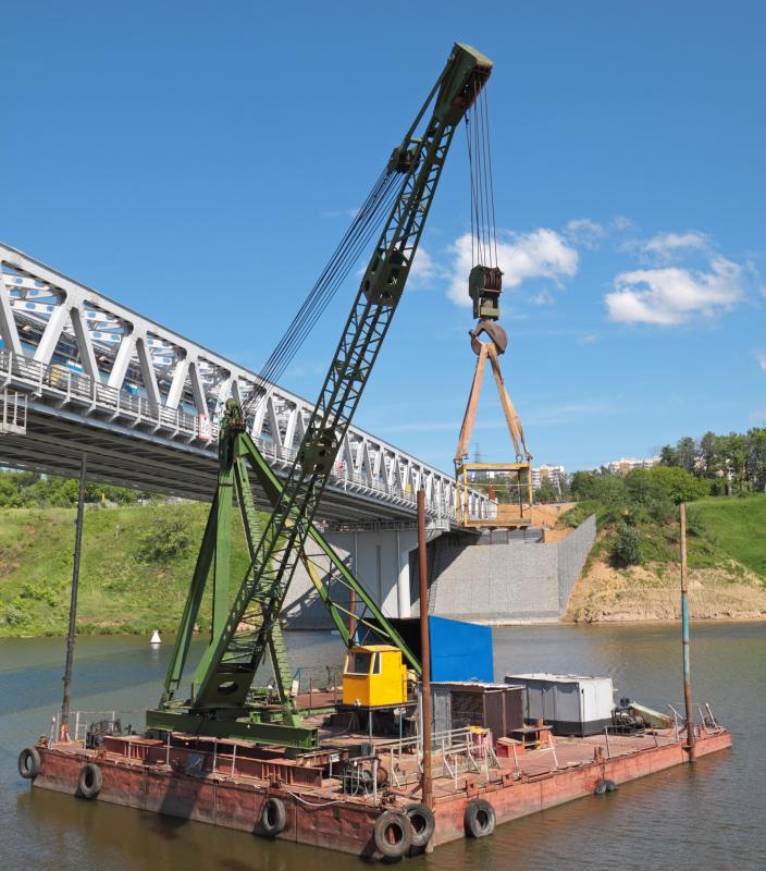 A floating crane located on a barge.
