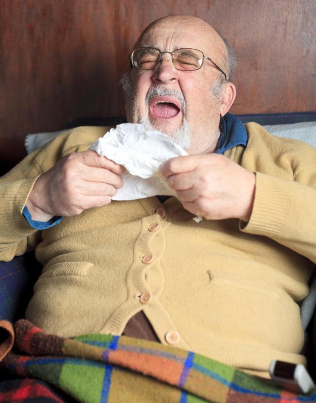 A person who is sick with a cold often experiences coughing.