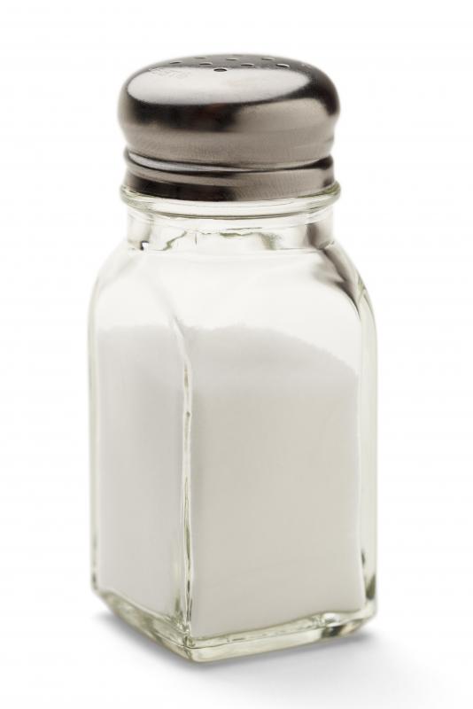 Rubbing hands with table salt may help get garlic smell off of fingers.