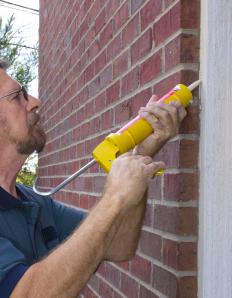 Applying expansion joint sealant to a wall