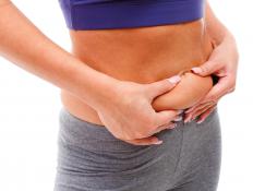 A person with a small amount of belly fat