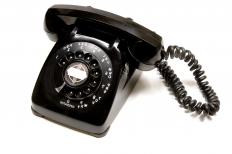 A corded telephone, the precursor to a cordless telephone