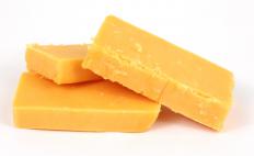 Sharp cheddar cheese can make a good topping for a ground beef pizza.
