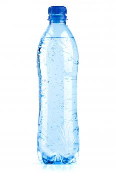 Bottled water, one of the supplies for tent camping.