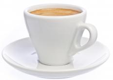 A cup of coffee, which is often served with apple coffee cake.