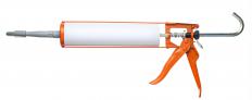 A caulk gun, which can be used to fix linoleum.