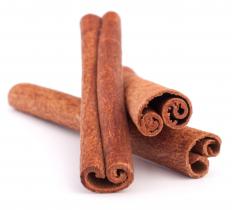 A cinnamon stick. Cinnamon is often used to season flan.