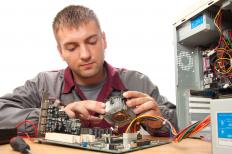 A computer technician working on a computer.