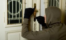 A man robbing a home, which is typically considered a class C felony.