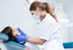 A dentist doing an exam on a Medicaid patient.