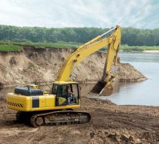 Backhoes are used for excavating rocks and dirt.