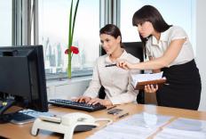 An administrative assistant going over her supervisor's schedule.