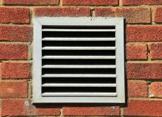 Exterior wall vent leading to an HVAC system.