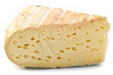 A thick wedge of fontina cheese 