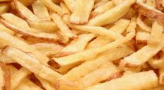 French fries cooked in a deep fryer.