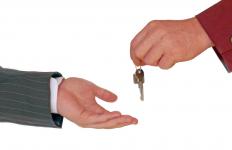 A person returning keys to a bank.