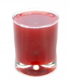 A glass of prune juice.