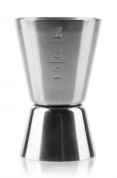 A jigger is used to measure alcohol to make a daiquiri.