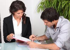 A man obtaining financing at a bank to start a construction company.