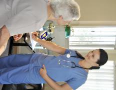 A medical assistant taking a patient's history in a family practice.