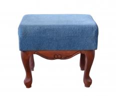 An upholstered footstool.