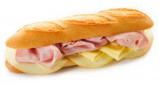 A submarine sandwich with deli meat and cheese.
