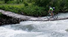 A person mountain biking at a wilderness resort.