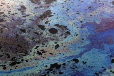Oil floating on water.