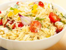 Orzo salad including grape tomatoes, yellow peppers and onions