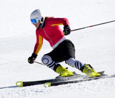 A person skiing as part of a biathlon.