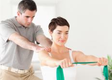 A travel physical therapist working with a client.