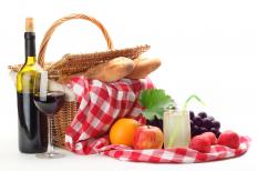 A picnic basket with a water resistant blanket.