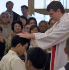 A priest being ordained.