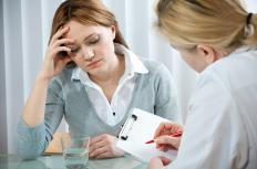 A doctor talking to a woman with prenatal depression.