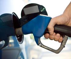A man filling up his car with gasoline.