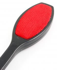 Lint can be removed from a beaver hat by using a lint brush.