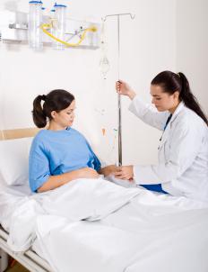 A registered nurse checking on a patient. 