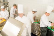 Chefs working in a restaurant kitchen.