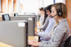 Sales representatives chatting with clients on the phone.