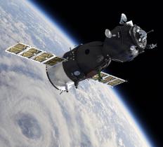 GPS receivers communicate with satellites that orbit the Earth to pinpoint the user's location.