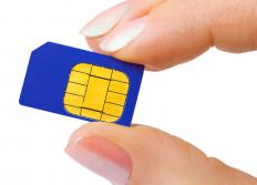 A person removing the SIM card from a water damaged phone.