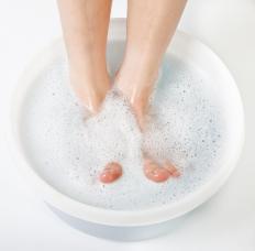 A person having a baking soda foot bath.
