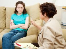 A therapist working with a juvenile delinquent.