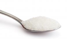 Granulated sugar, which is used to make raspberry coulis