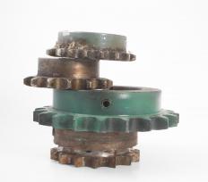 A cam sprocket is attached to a camshaft in a combustible engine to help maintain timing.
