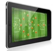 A tablet computer running a game, a type of software.