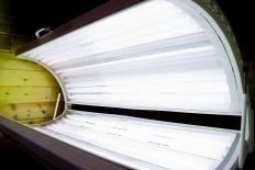 Tanning beds can cause white spots on the skin.