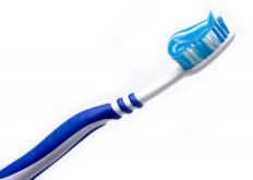 A toothbrush with toothpaste on it.