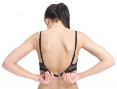 A woman wearing a bra with elastic in the straps and band.